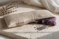 Oatmeal linen Aūra weighted eye pillow with amethyst insert and lavender